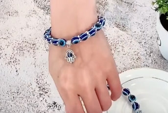 Hand van Fatima, en evil eye armband.